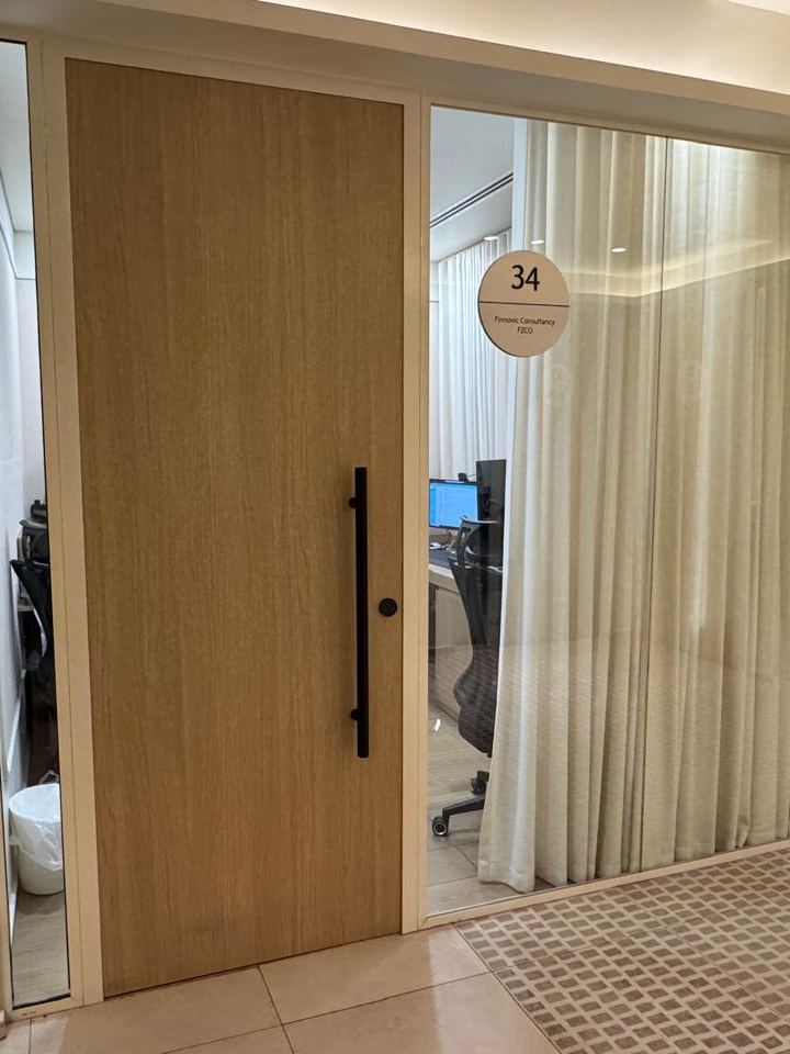 The door to Office 34, bearing the nameplate Finnovic Consultancy FZCO, at the Finnovic office in Al Mankhool, Dubai